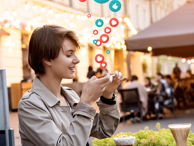 Happy mllennial girl blogger taking food picture on phone in cafe get likes.