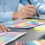 Graphic designer or creative working together coloring using gra Ihre Werbeagentur und Marketingagentur für Website Programmierung, Kataloge, Webshops, Logo Entwicklung, Corporate Identity, Print, E-Commerce in Bonn und Köln – Werbeagentur citos
